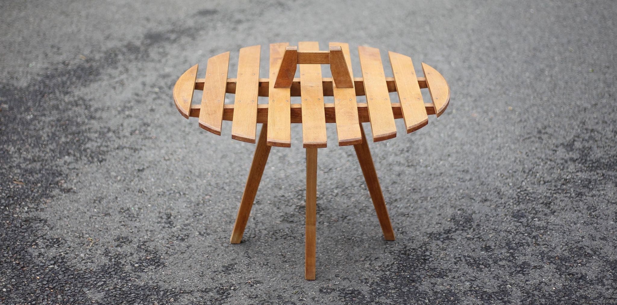 Vintage coffee table, wooden table with central handle, interior decoration, terrace, patio