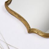 Old wooden mirror gilded with gold leaf