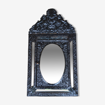 Mirror, beaded cupboard in embossed brass