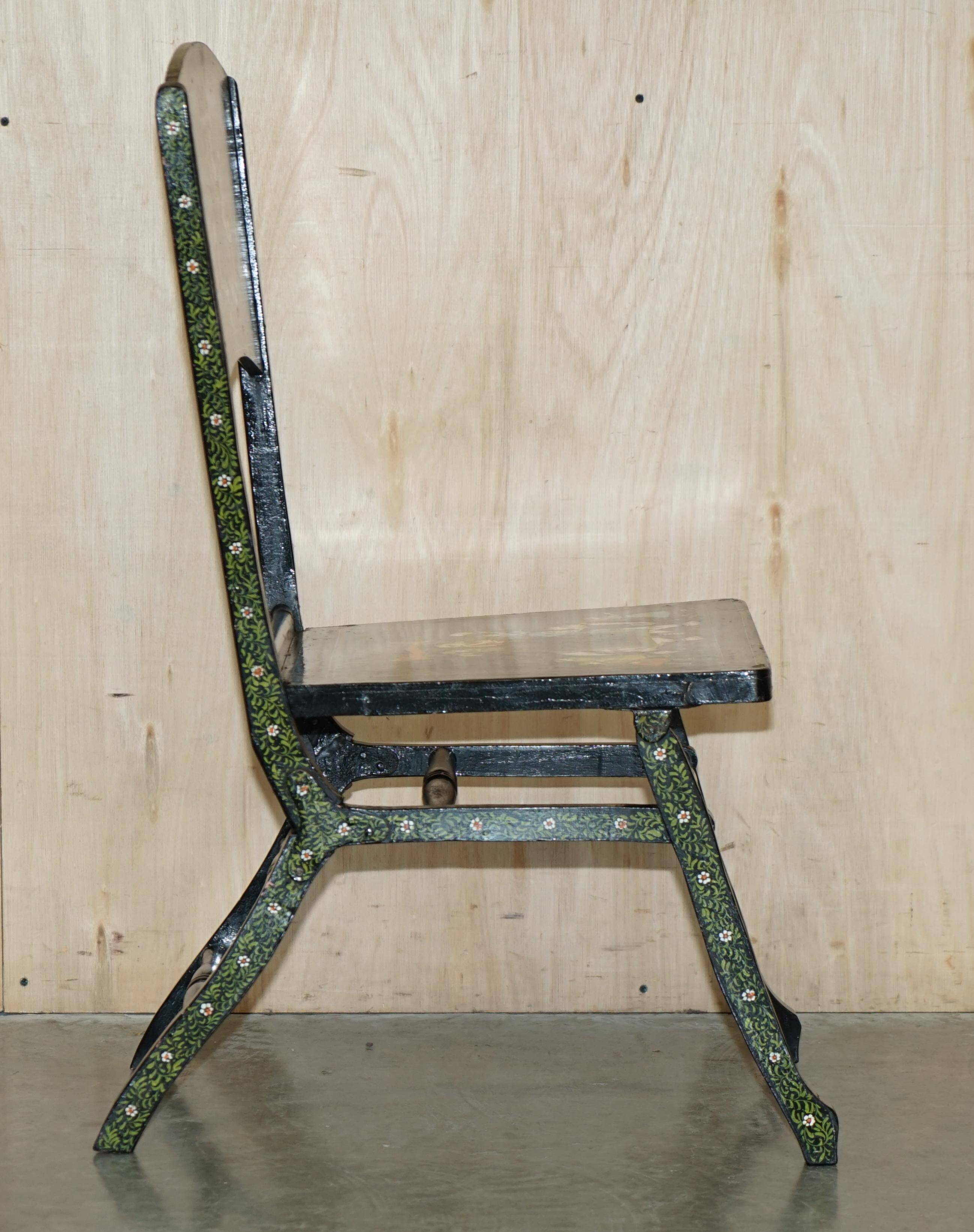 Pair of military folding chairs with Indian decoration.