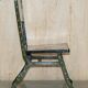 Pair of military folding chairs with Indian decoration.
