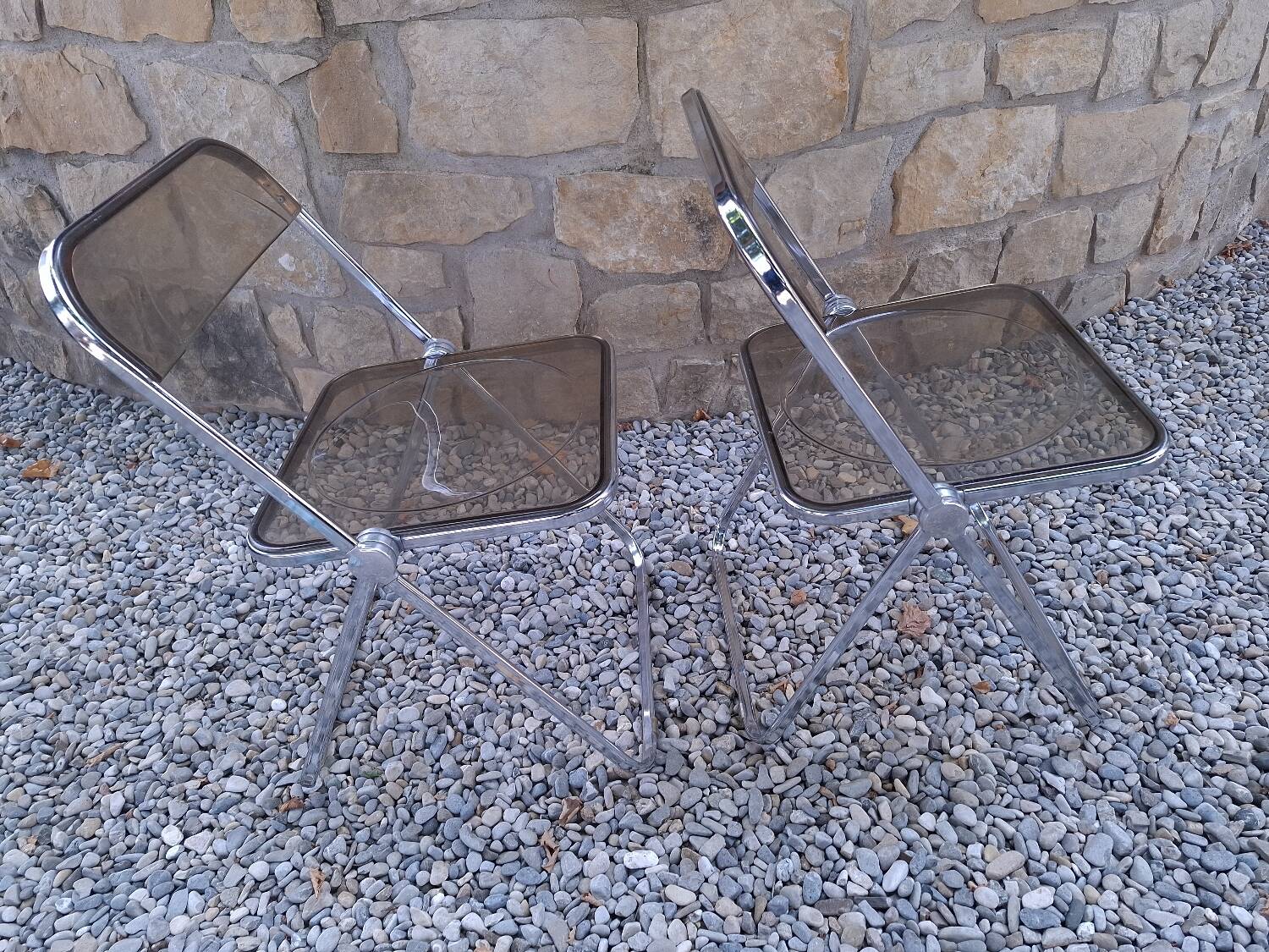 2 folding chairs designed by Giancarlo Piretti for Castelli