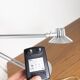 Grey LED architect lamp with spring arm and swivel base.