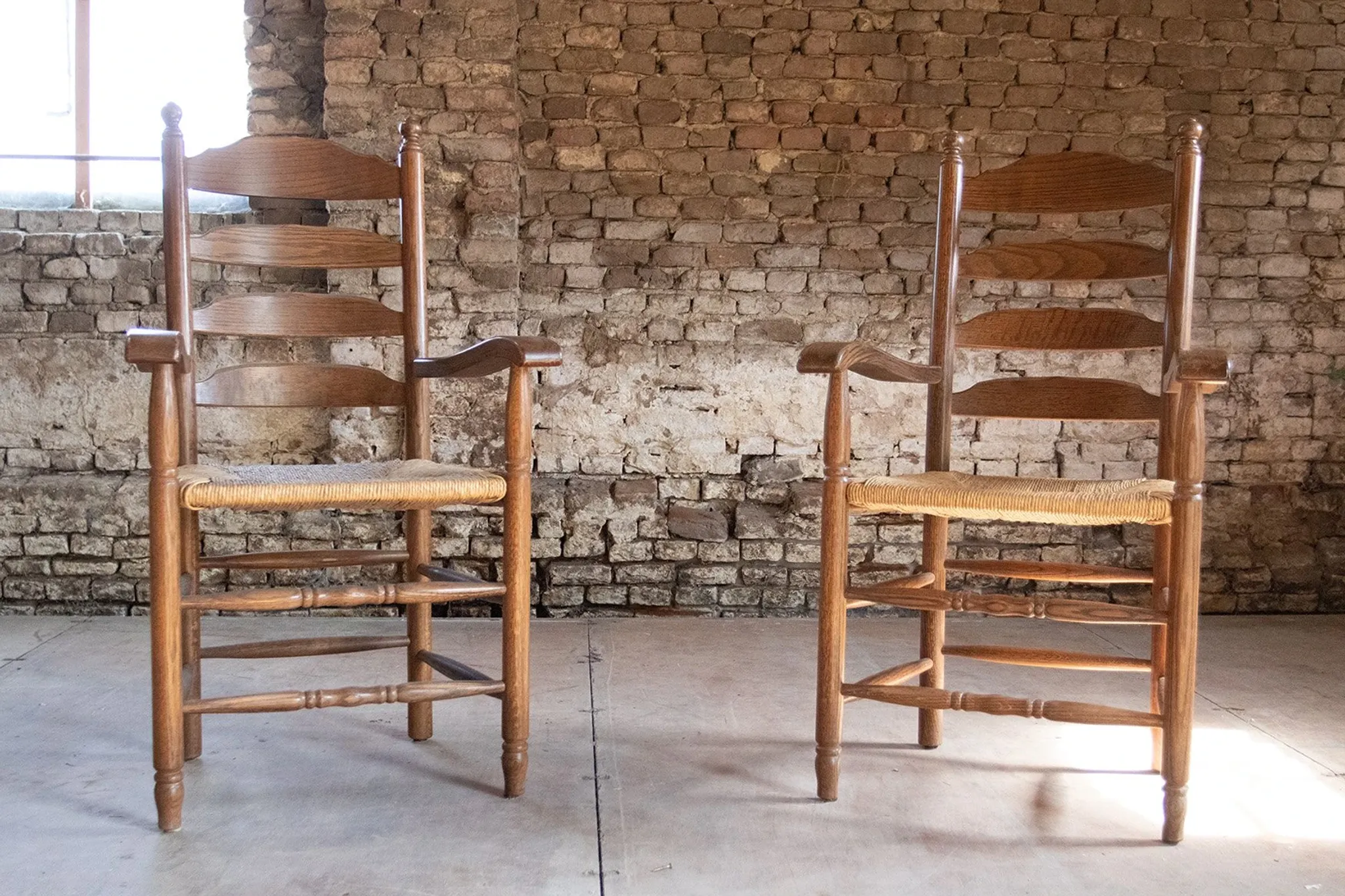 Pair of Dutch oak ladderback armchairs with rush seats – 1960s