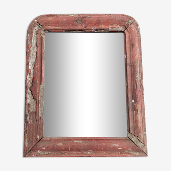 Old mirror in red wood