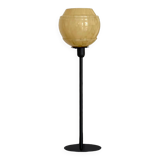 Table lamp with an old vintage glass lampshade, between gold and camel