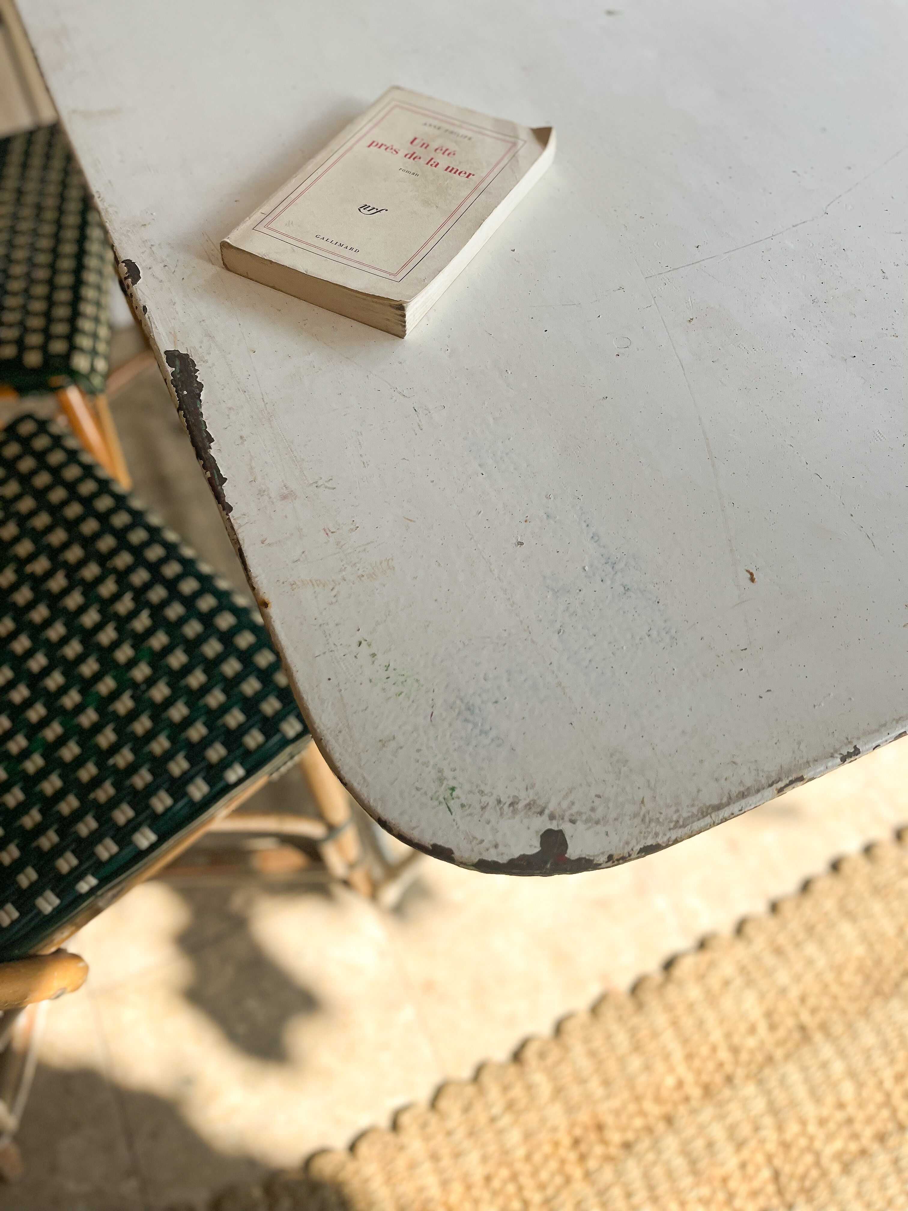 White folding metal bistro table