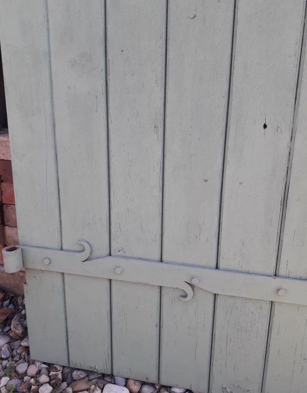 Pair of wooden shutters hanging iron