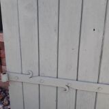 Pair of wooden shutters hanging iron
