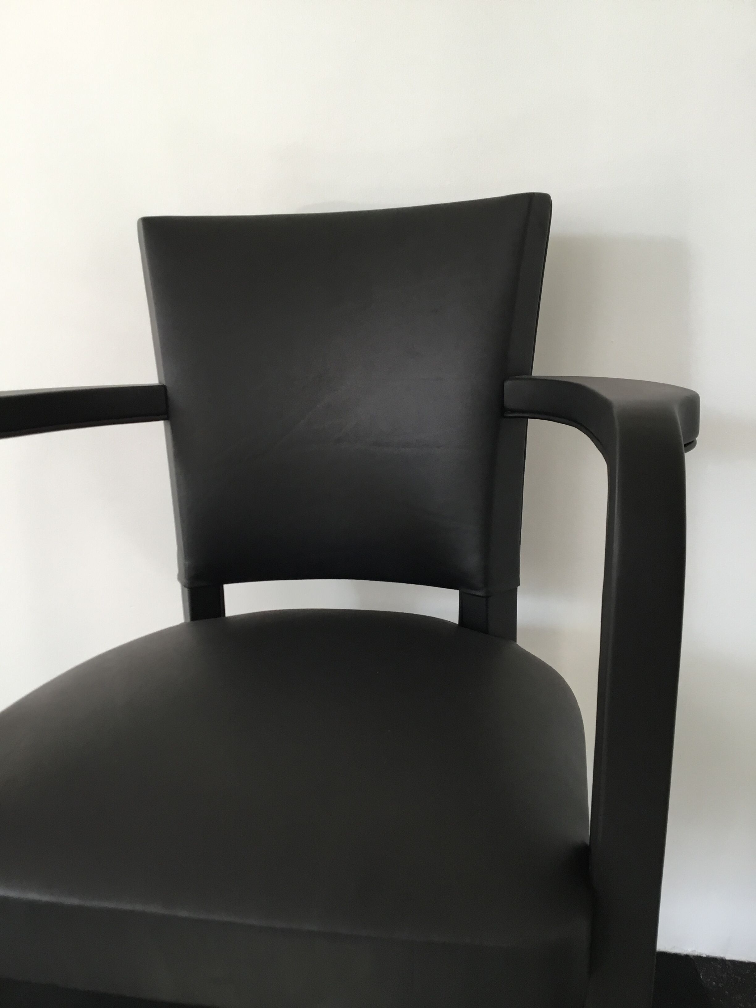 Leather-wrapped black bridge chair