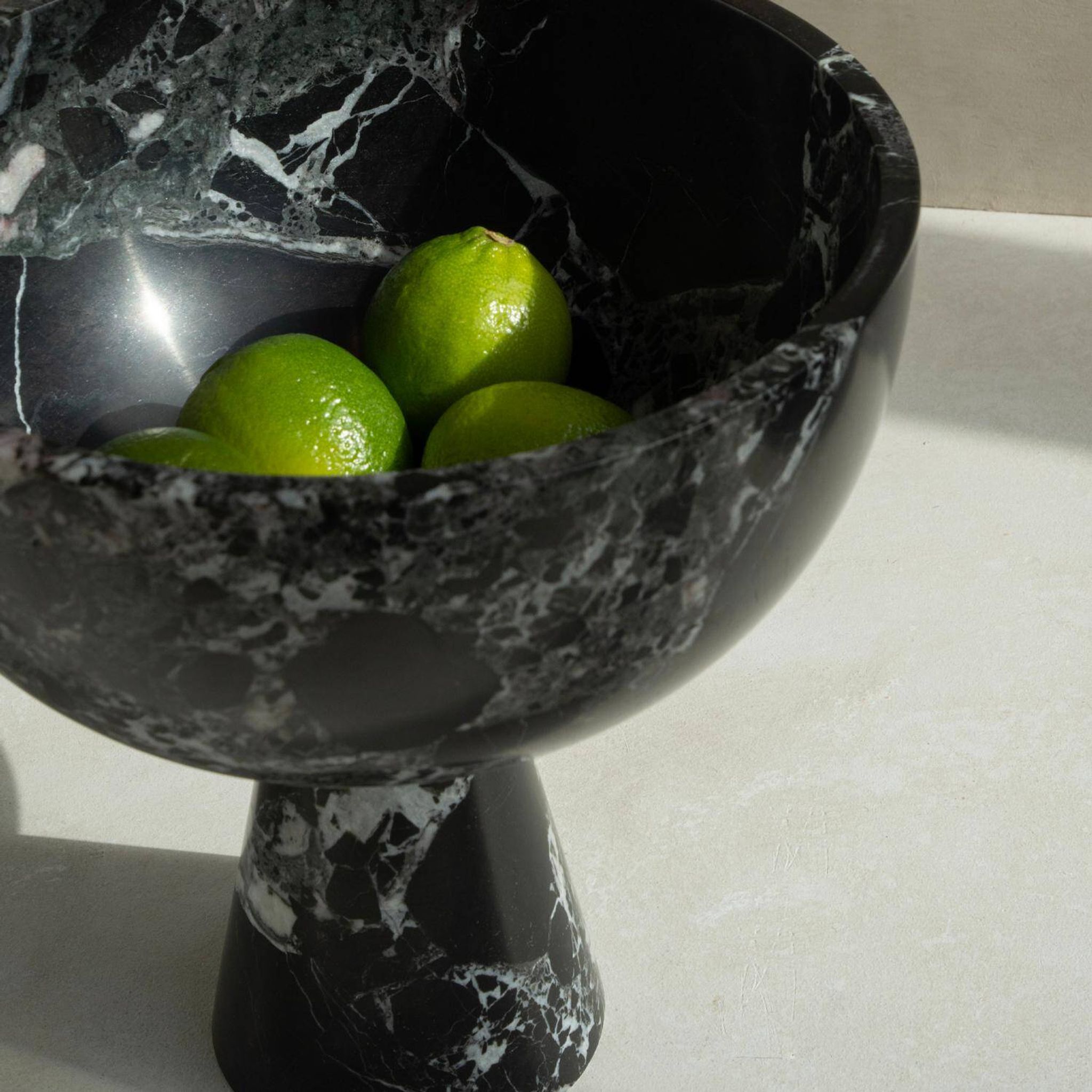 The XL Pedestal Bowl in black and green marble