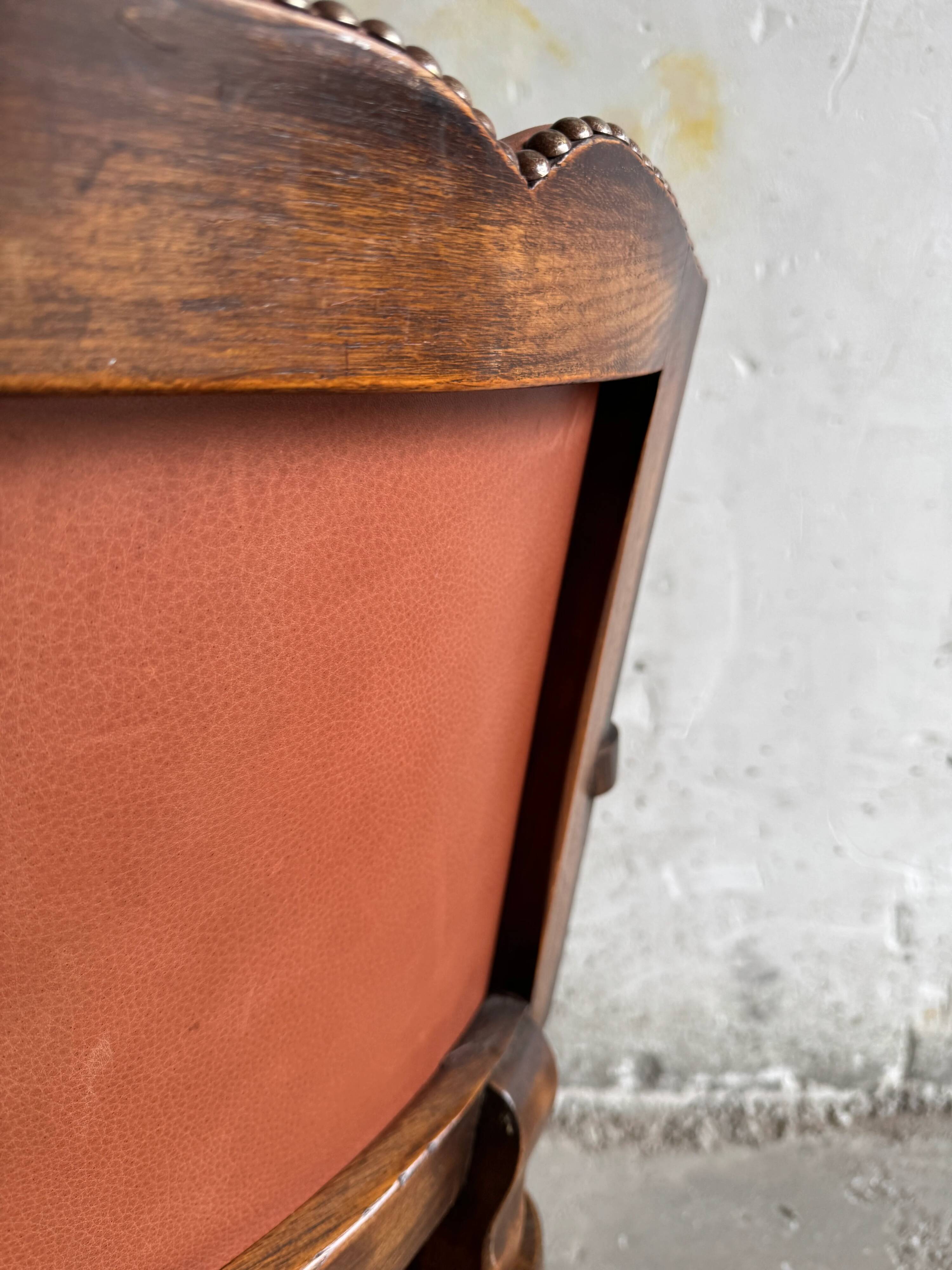 Brutalist dark brown solid wood armchair with natural rattan seat and cognac leather back