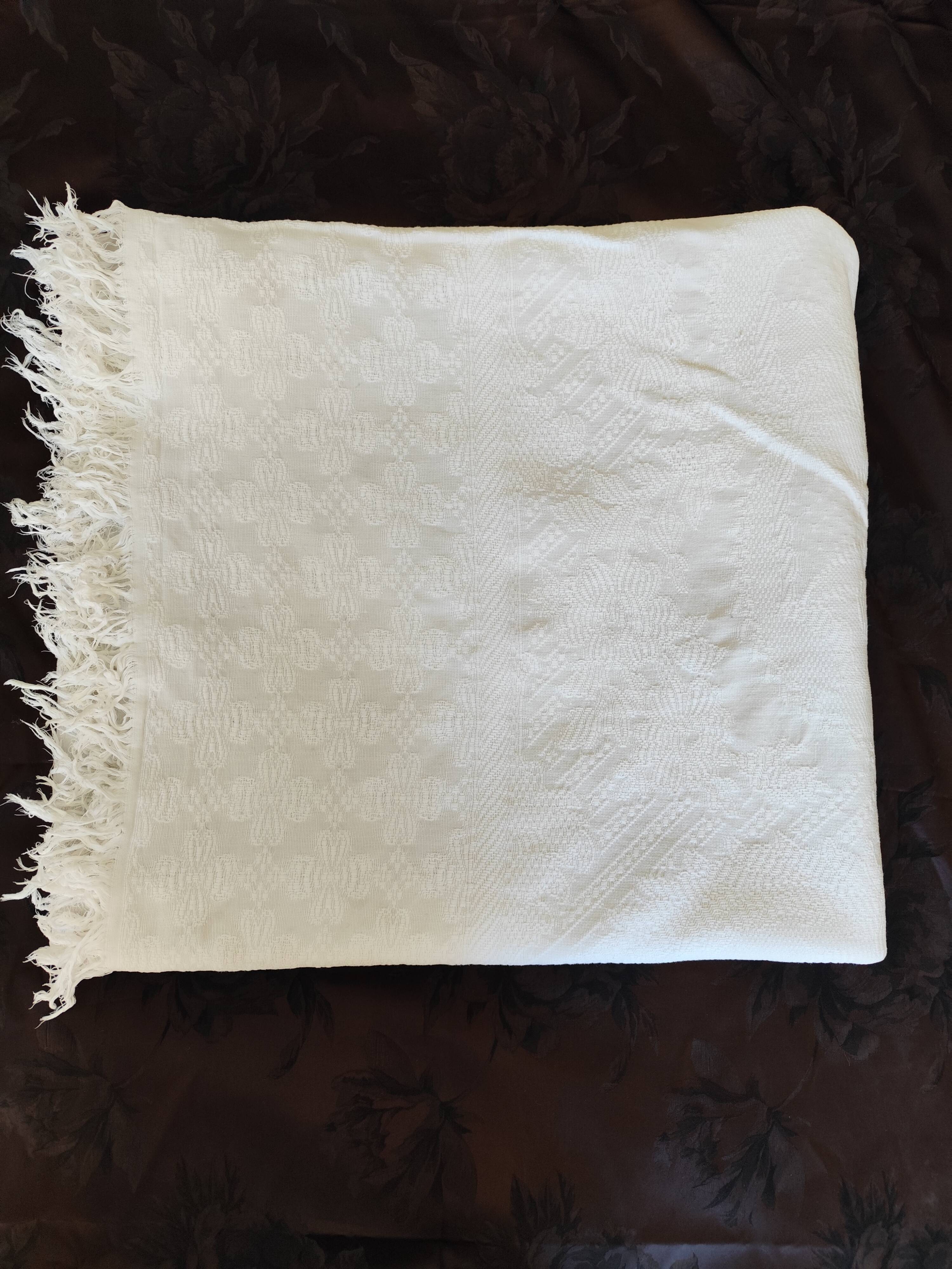 White woven cotton bedspread with fringes