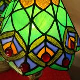 Pair of art nouveau bronze lamps, Tiffany-style glass lampshades