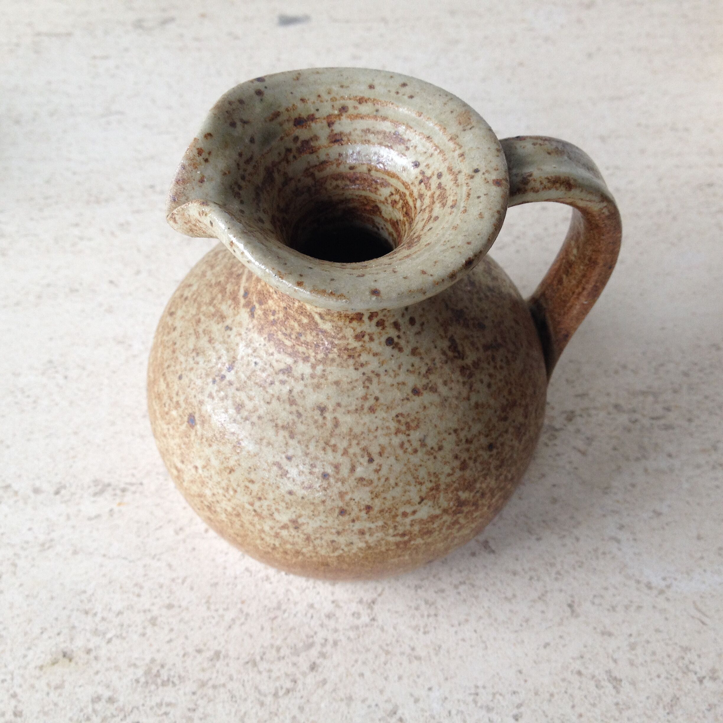 Duo of pitchers in stoneware