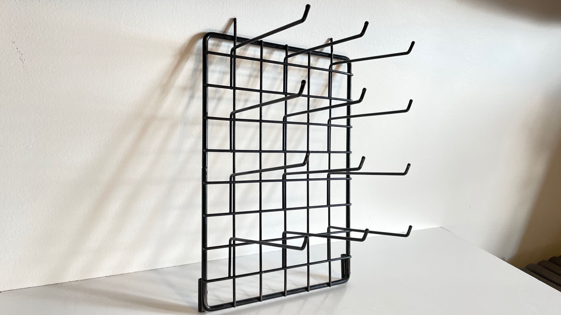 Vintage black metal wall loom display