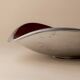 Red enameled steel bowl with textured interior and silver exterior; vintage Italian 1970s design