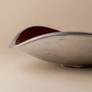 Red enameled steel bowl with textured interior and silver exterior; vintage Italian 1970s design