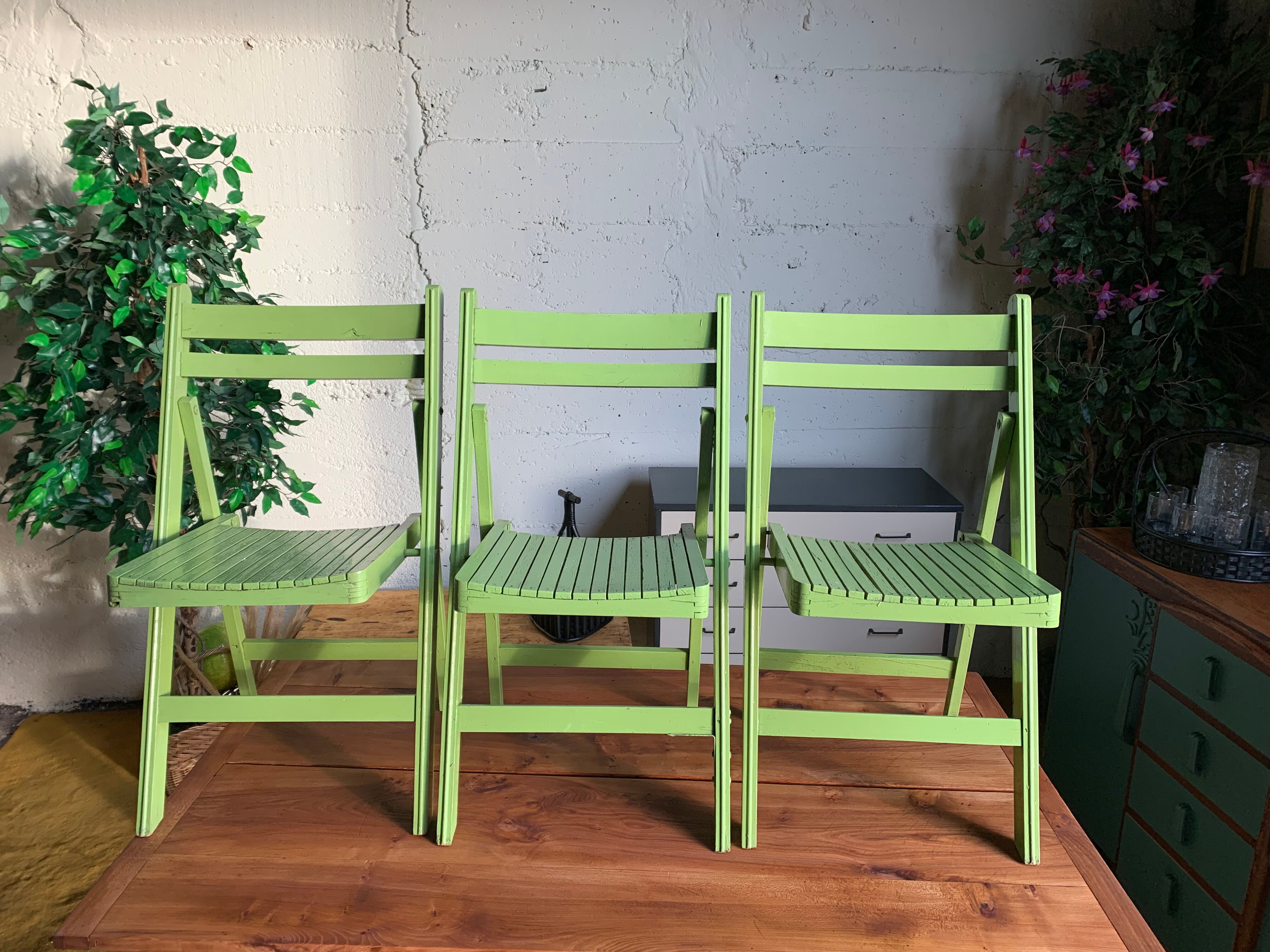 3 wooden folding chairs