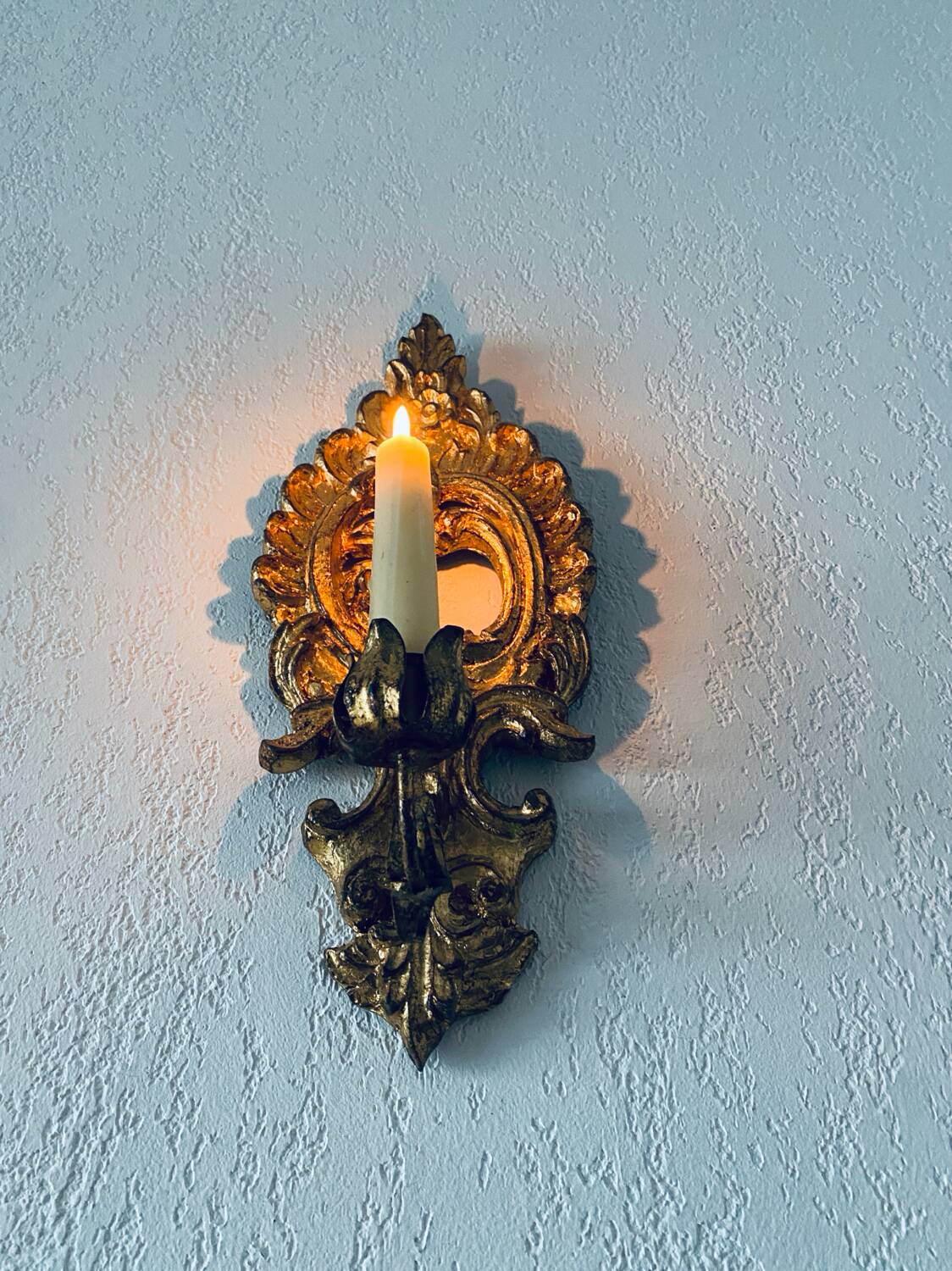 Gold wall candle holder