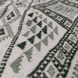 Handwoven white and green rug