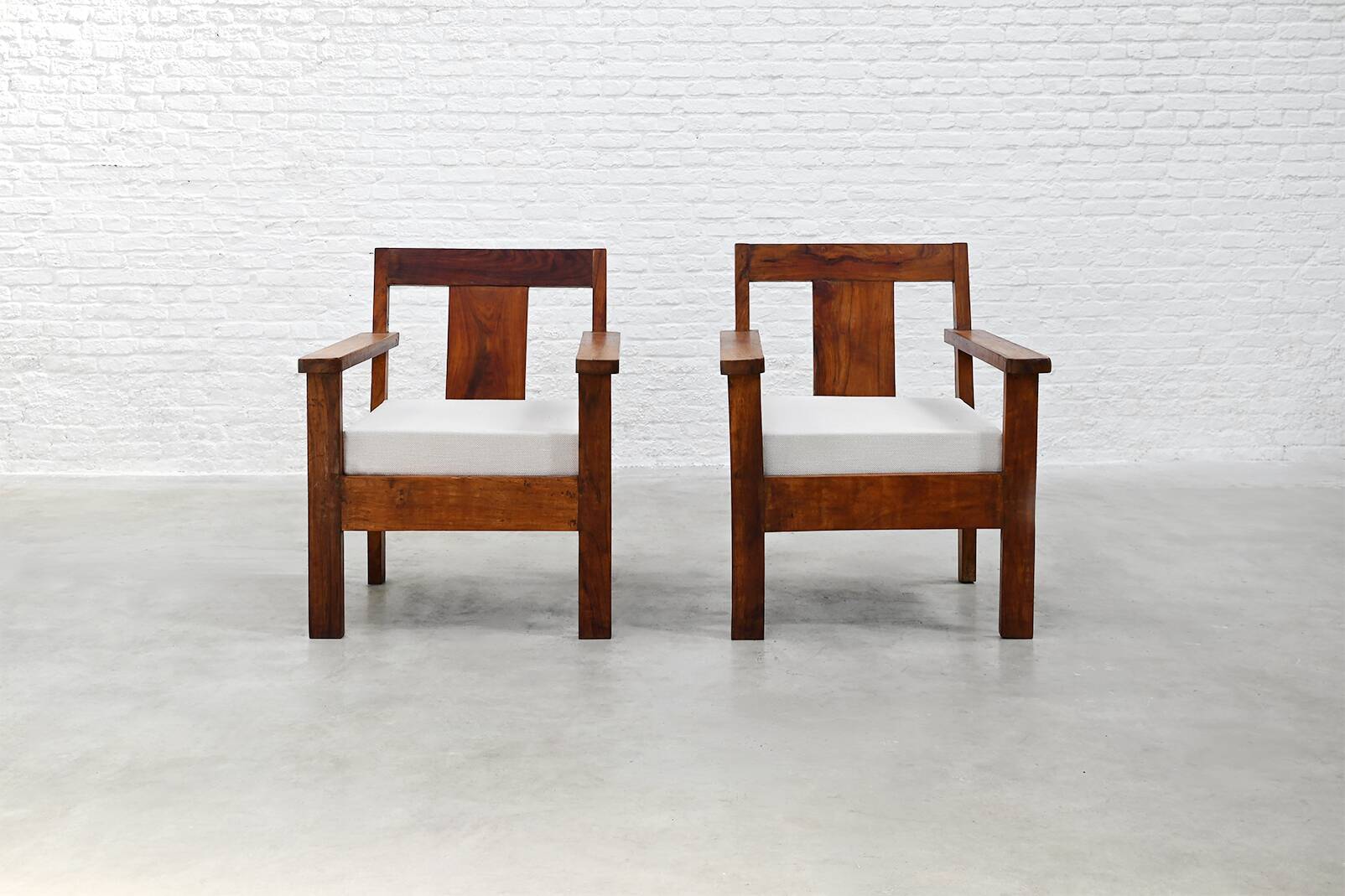 Pair of French modernist teak armchairs, 1960s