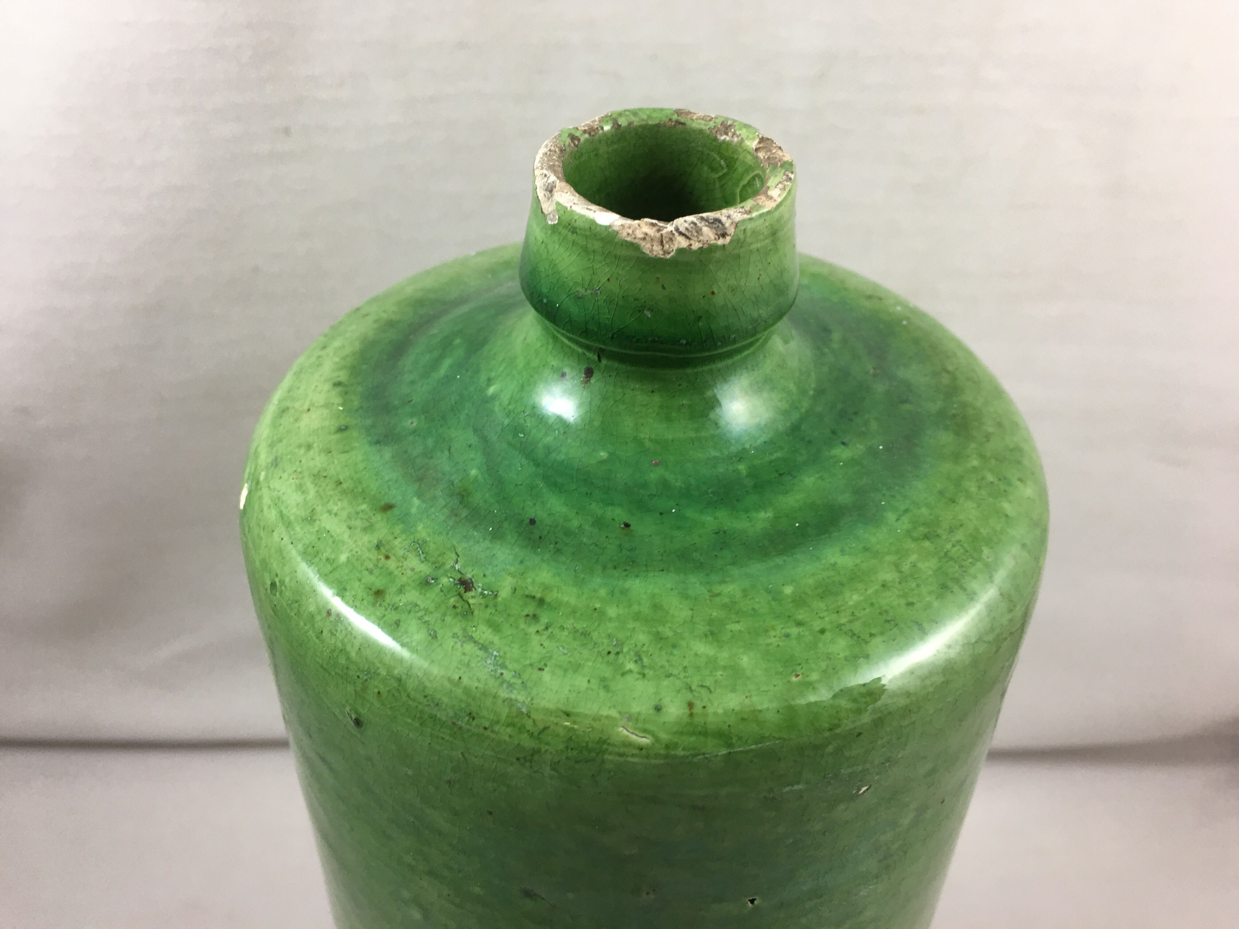 Green glazed terracotta bottle deco