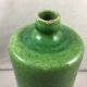 Green glazed terracotta bottle deco