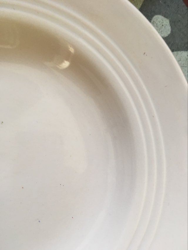 Matching old hollow plates in pink and green.