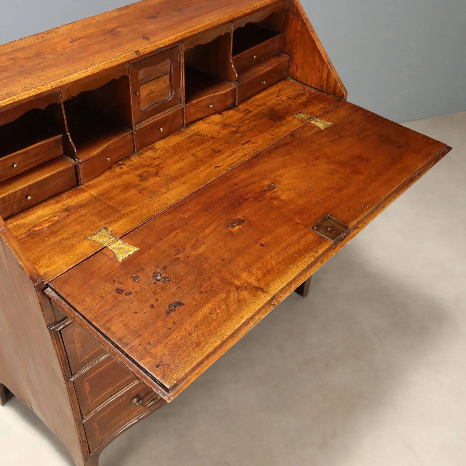 Antique drop-leaf cabinet in walnut with maple inlays, Italy, mid-18th century.