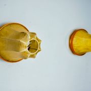 Pair of "cocoon" wall lights, pear shape, resin and pine, Italy, 1970