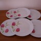 6 white porcelain dessert plates decorated with pink tulips