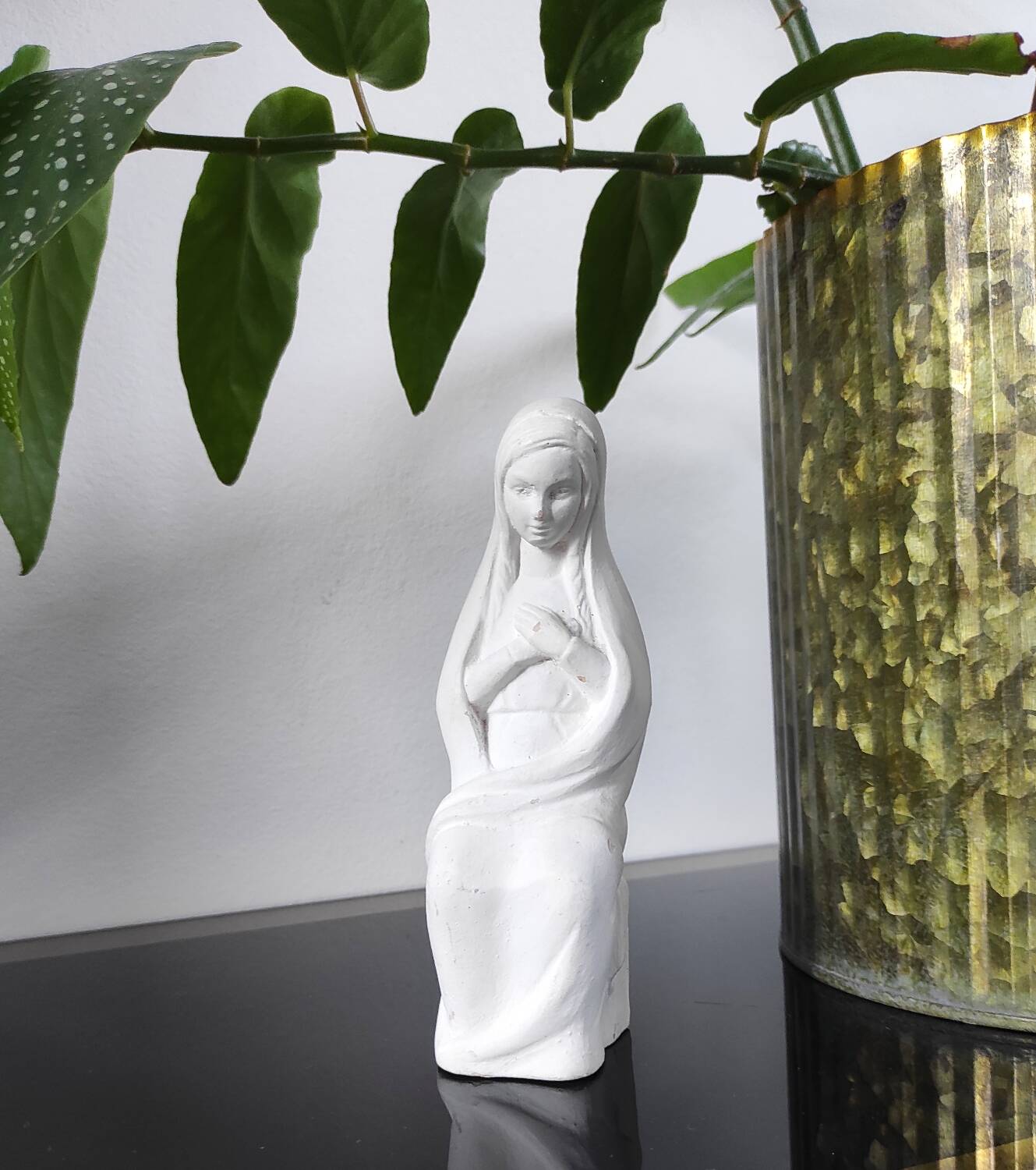 Vintage white plaster statuette of the Virgin Mary.
