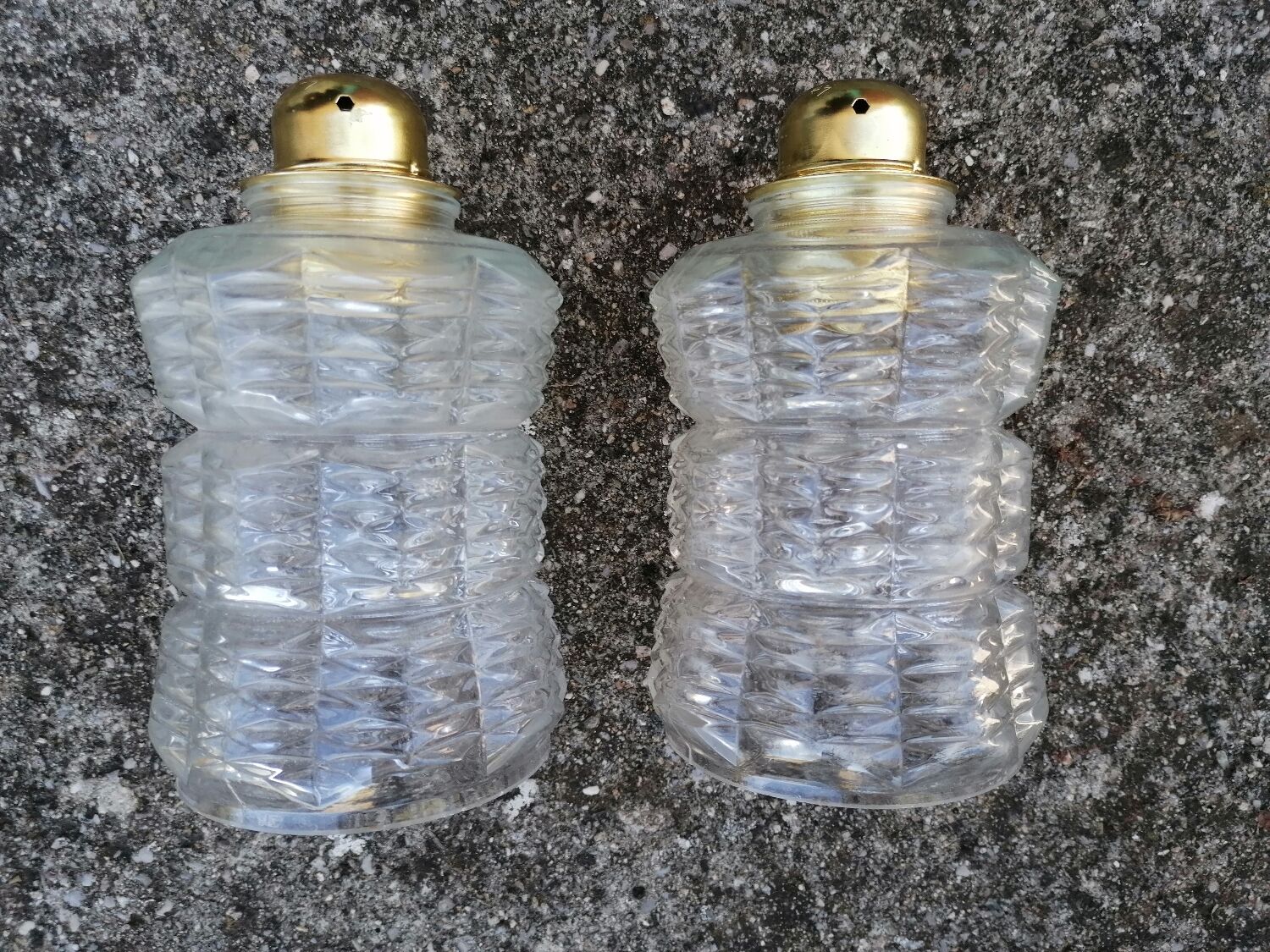 Duo of vintage molded glass globe pendant lights.