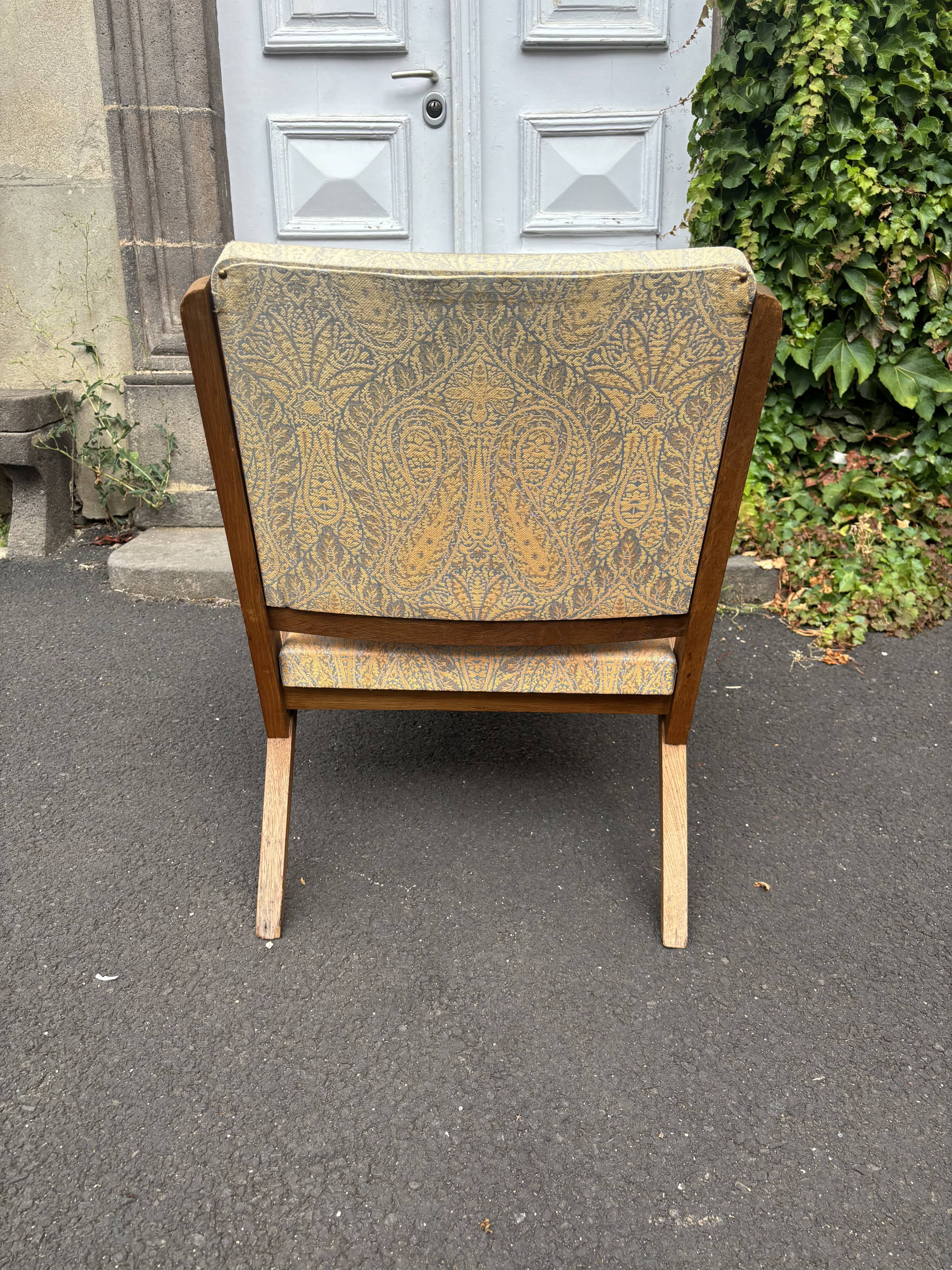 Vintage wooden armchair from the 1960s