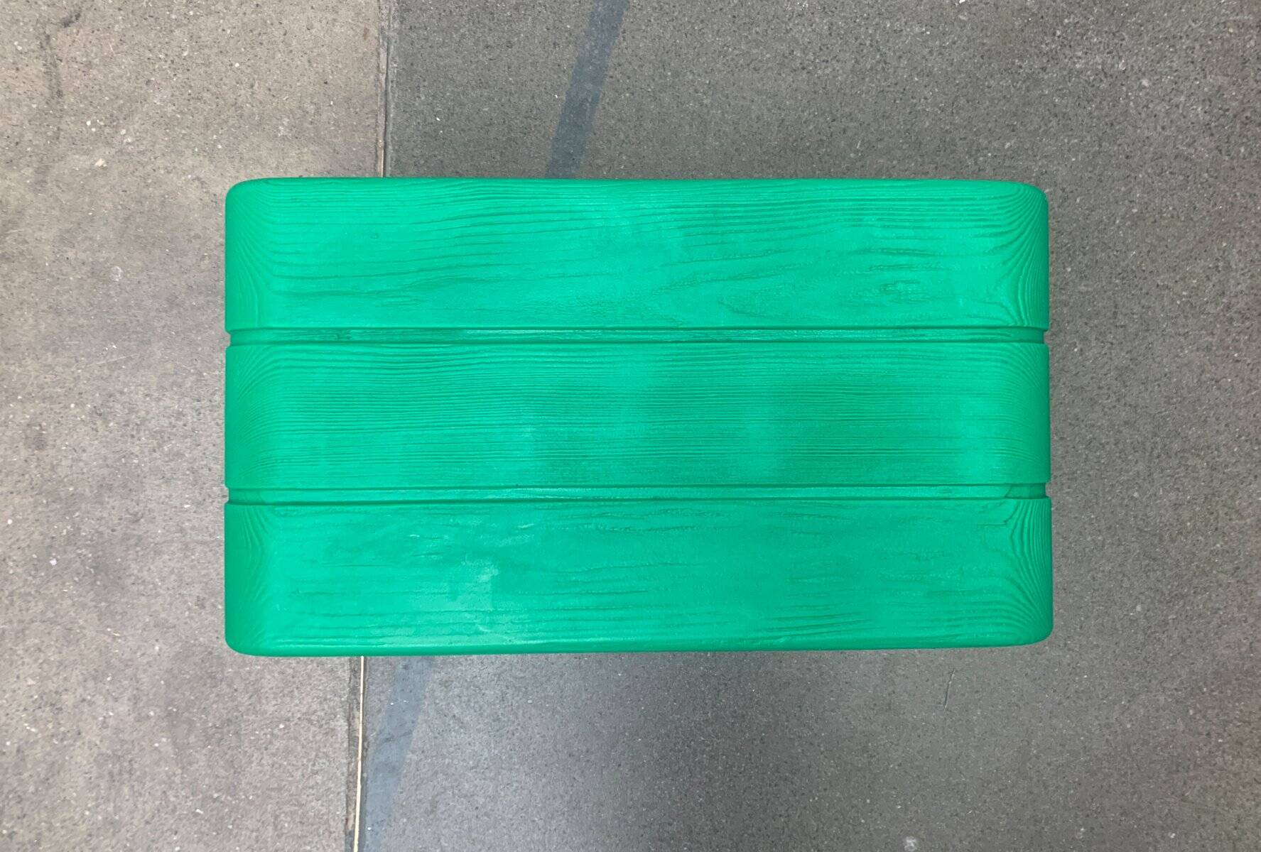 Postmodern plastic stool with a wood effect.