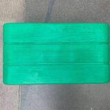 Postmodern plastic stool with a wood effect.