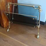 porte revues en bronze et verre teinté 1950 à pieds griffés