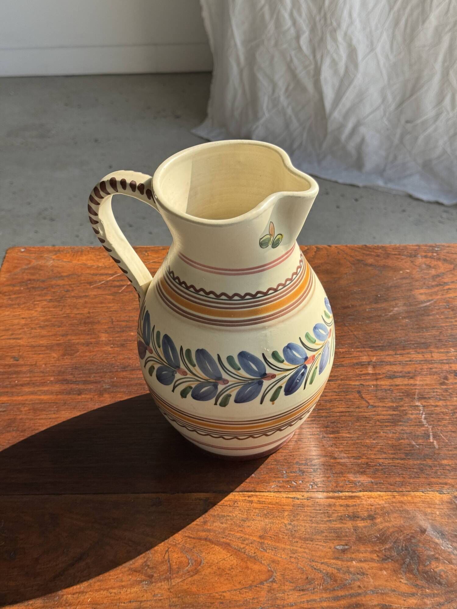 Beige carafe with stylized blue flower friezes