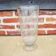 Ancient transparent glass vase with engraved plant decoration.