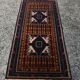 Vintage Persian Baluch rug, hand-knotted wool, 1970.