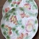 Two slip plates decorated with fruit.