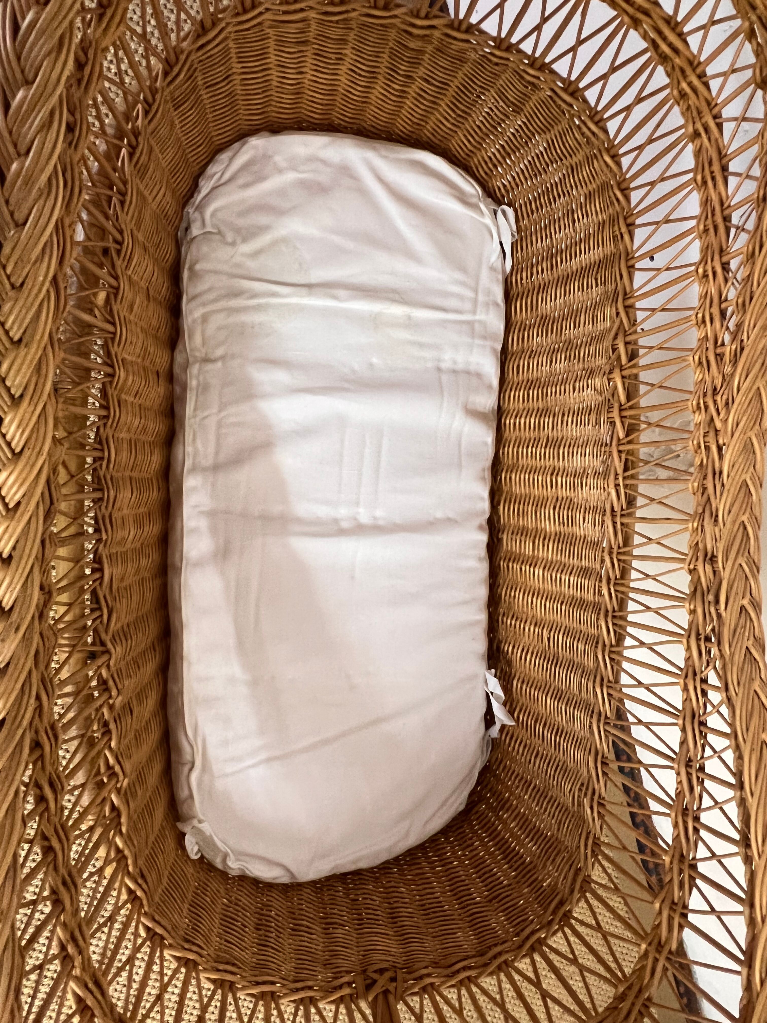 Rattan cradle on wheels