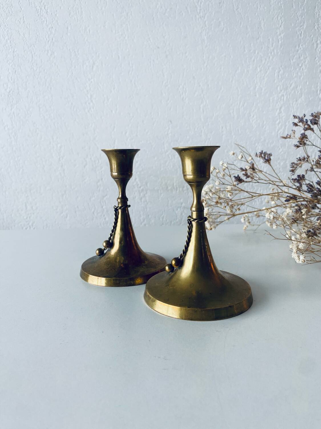 Pair of brass cord candle holders