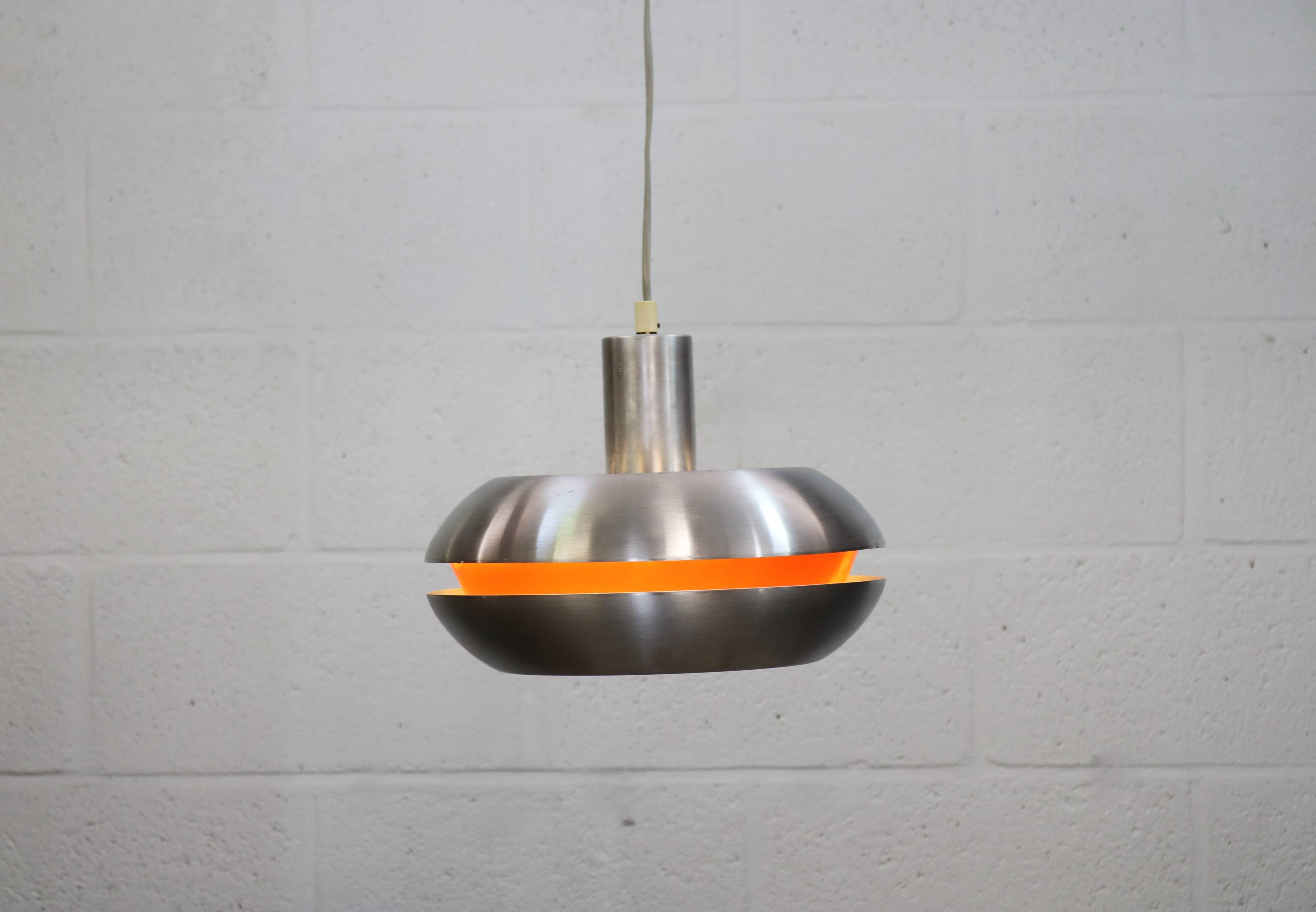 Old Danish space age design lamp in alu and orange inside.