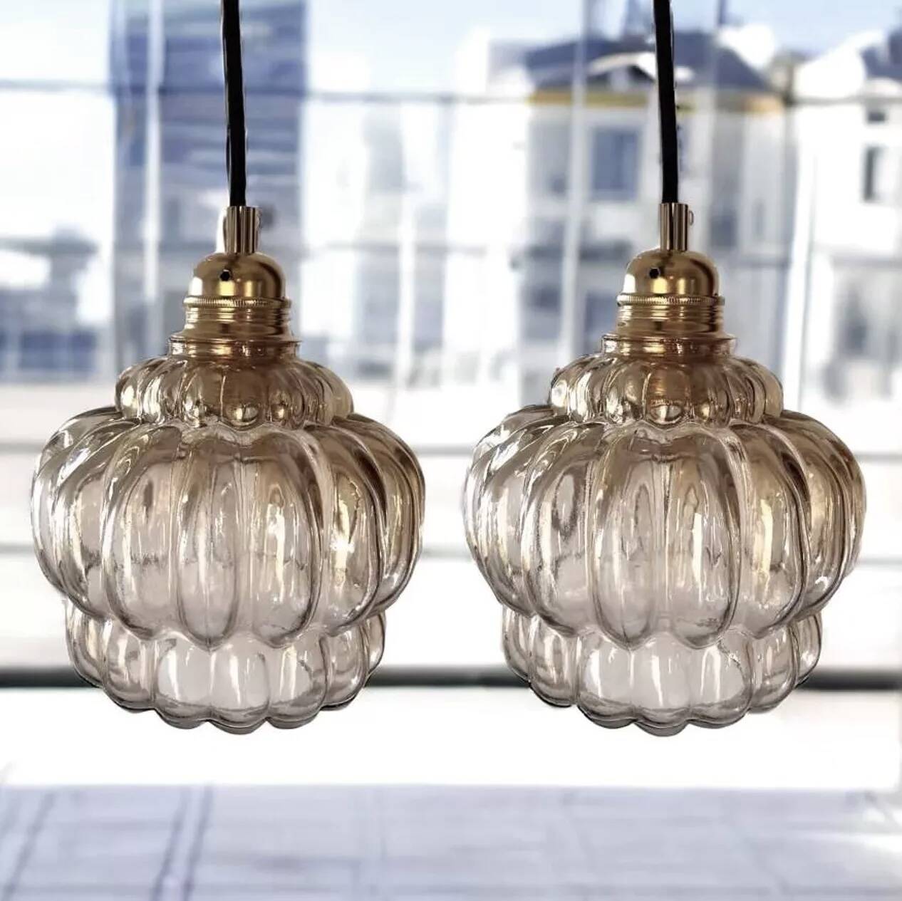 Pair of vintage amber glass pendant lights