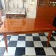 Mid-century vintage coffee table with tapered legs.