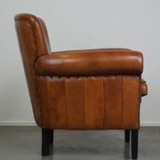 Fauteuil en cuir de mouton à l'aspect luxueux