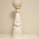 White ceramic table lamp, an elephant holding a lighted ball