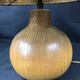 Vintage modernist lamp in wood and hammered copper.